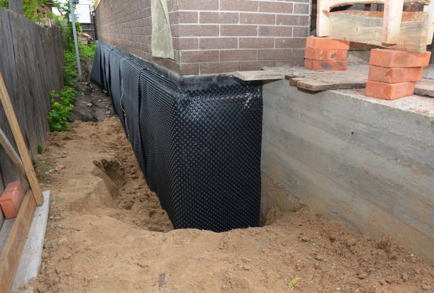 SJ Waterproofing Pros technician performing targeted Exterior Waterproofing assessment in Osseo, MI